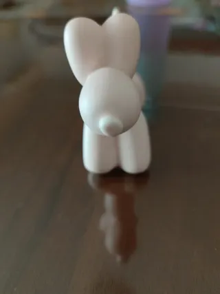 Statua cane palloncino rosa