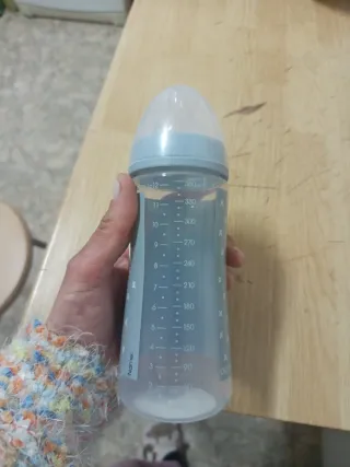 Biberón nuevo con diseño de mapache