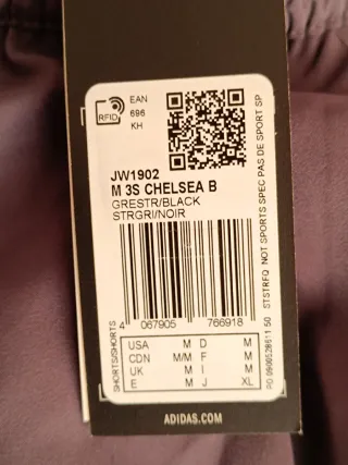 Pantalón corto Adidas Essentials Chelsea Gris.