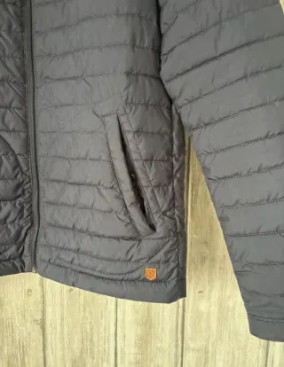 Cazadora de plumas azul de hombre