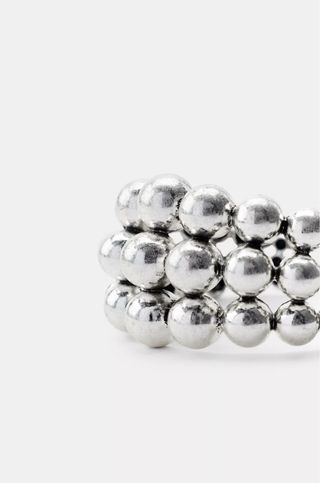 Pulsera rígida Zara bolas metálicas plateada