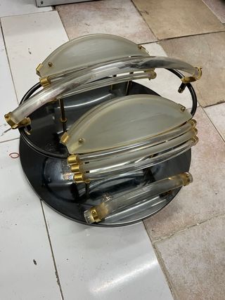 Lámpara de pared dorada y transparente