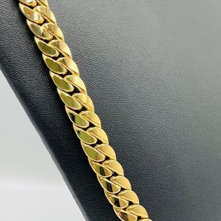 CADENA CUBANA,HUECA CON CIERE CIRCONITA ORO 18K.