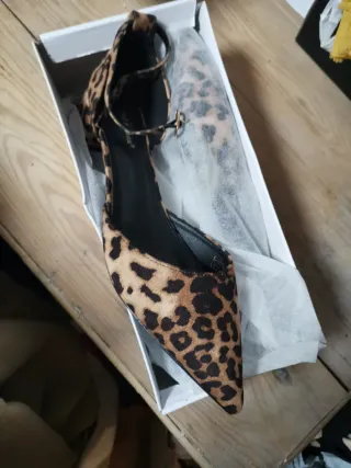 Zapatos planos con estampado de leopardo