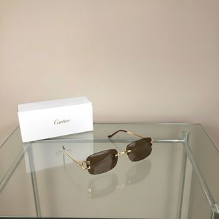 Gafas de sol Cartier doradas y marrones