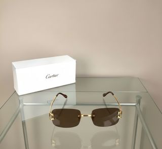 Gafas de sol Cartier doradas y marrones