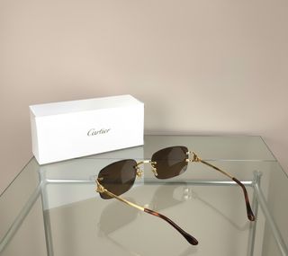 Gafas de sol Cartier doradas y marrones