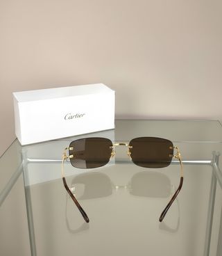 Gafas de sol Cartier doradas y marrones