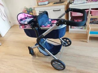 Carrito de muñecas rosa y azul