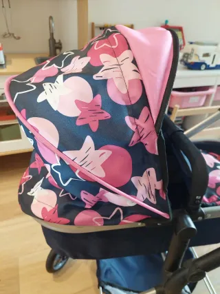 Carrito de muñecas rosa y azul