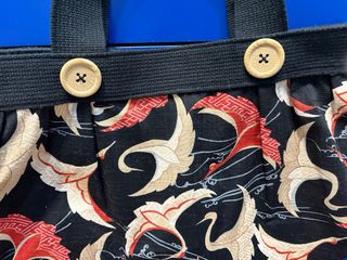 Bolso estampado con botones