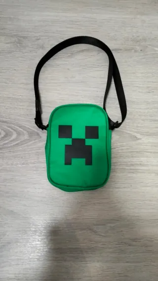 Bandolera verde con cara de Creeper