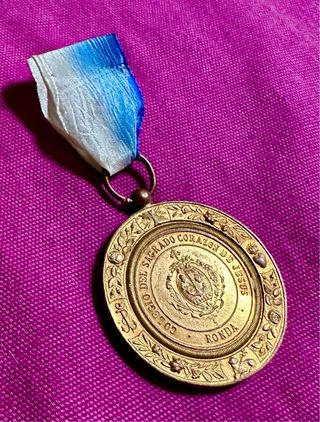 Antigua medalla escolar colegio Sagrado Corazón.