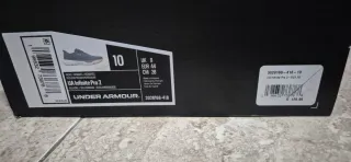 Zapatillas running Under Armour azules y naranjas