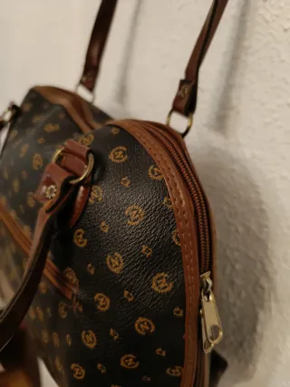 Bolso de mano marrón y negro pollini