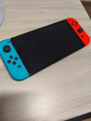 Nintendo Switch OLED Azul y Naranja con garantia