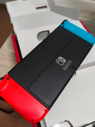 Nintendo Switch OLED Azul y Naranja con garantia