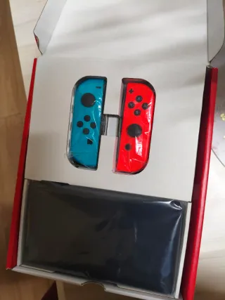 Nintendo Switch OLED Azul y Naranja con garantia