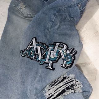 Jeans Amiri con Patch Drago
