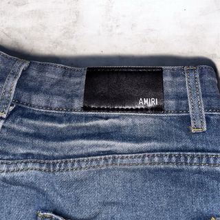 Jeans Amiri con Patch Drago