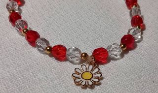 Pulsera con abalorio flor dorada y roja