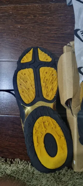 Tênis NIKE x NOCTA Preto e Dourado