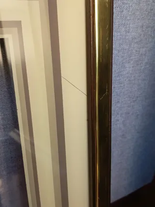 Marco de cristal dorado con paspartú