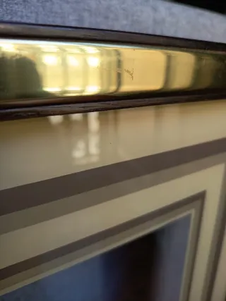 Marco de cristal dorado con paspartú