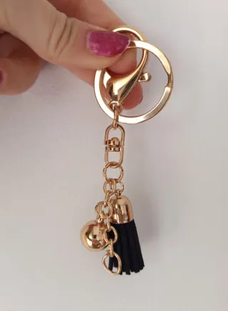 Colgante llavero con borla negra y dorada