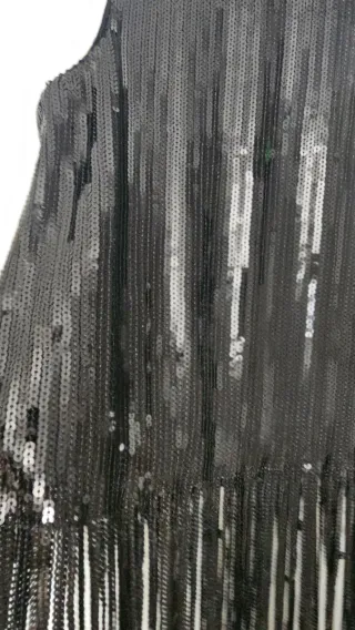 Top lentejuelas y flecos negro