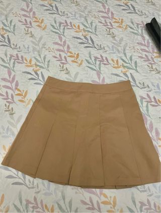 Falda de tablas H&M mostaza.