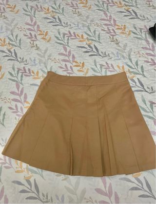 Falda de tablas H&M mostaza.