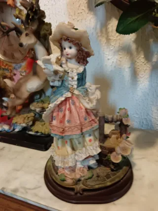 Reloj de sobremesa con figuras de ciervos