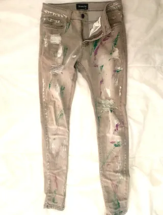 Vaqueros hombre con salpicaduras de pintura