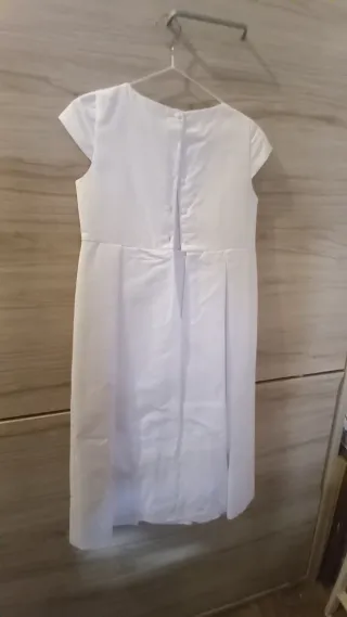 Vestido de comunión blanco con lazo rosa