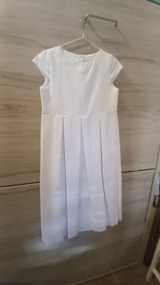 Vestido de comunión blanco con lazo rosa