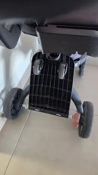 Carrito Stokke rosa con capazo y silla