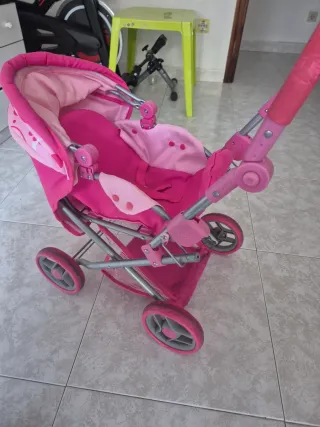 Carrito de bebé de juguete rosa