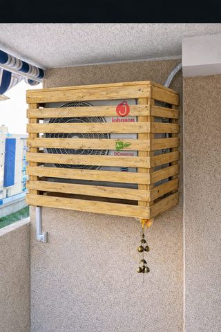 Cubierta de madera para aire acondicionado