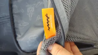 Maleta pequeña azul con dibujo de moto