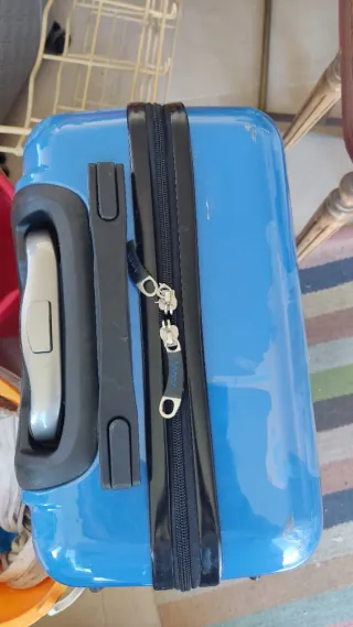 Maleta pequeña azul con dibujo de moto