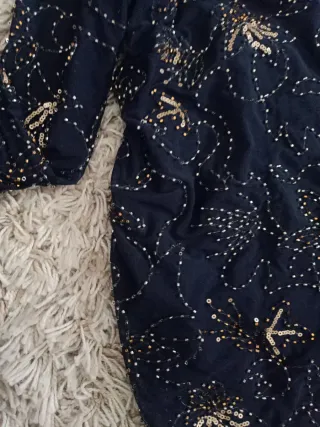 Top brillo negro y dorado