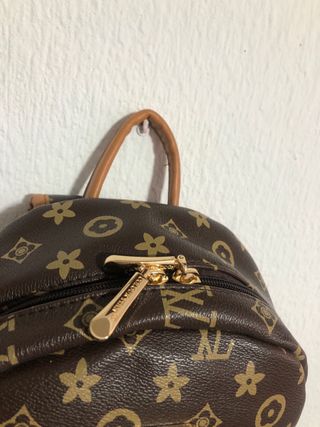 Bolso de mujer marrón y dorado