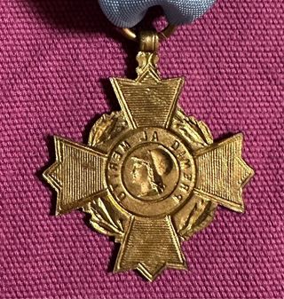 Vieja medalla escolar Premio al Mérito, Minerva.