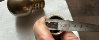 Pomelli per tende in metallo dorato