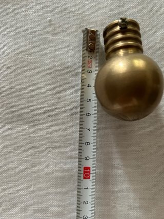 Pomelli per tende in metallo dorato