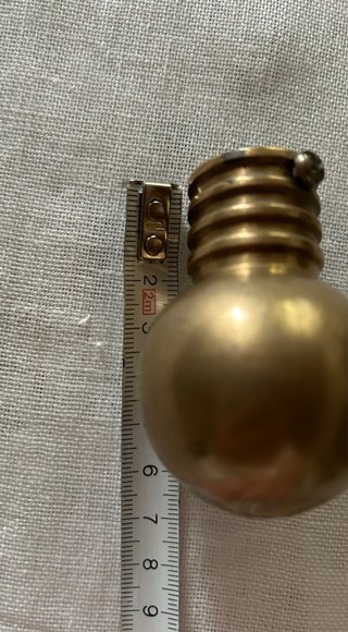 Pomelli per tende in metallo dorato