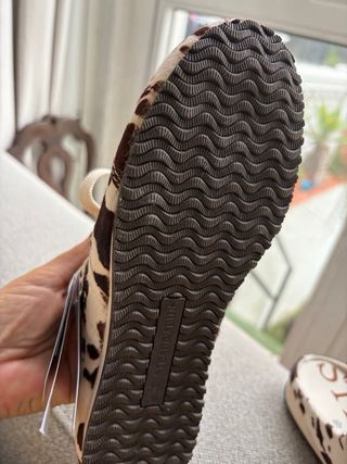 Zapatillas destalonadas estampado vaca