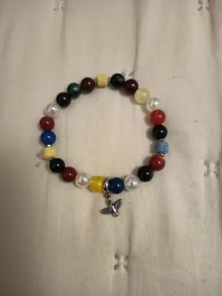 Pulsera piedras naturales con charm pajarito