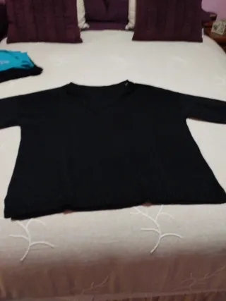 Conjunto Zara pantalón polipiel y suéter Cortefiel